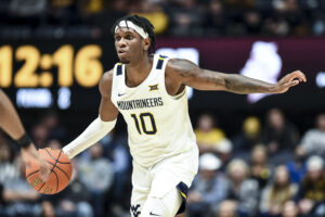 NOTEBOOK: Huggins wants to see better passes from point guards Kedrian Johnson, Malik Curry